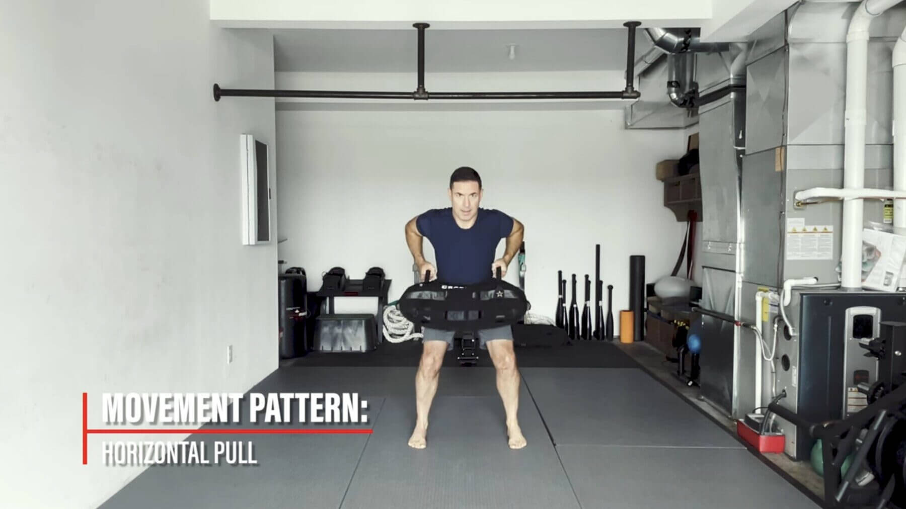 Training Exercise: Sandbag Base Stance Row